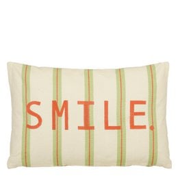 Decorative green cushion with the word "SMILE" printed in orange letters. The cushion has a striped pattern in shades of green and white.