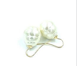 Small baroque pearl earrings, color white