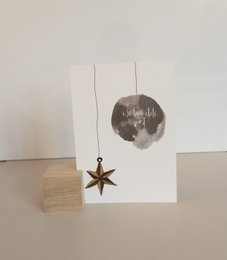 Christmas card with a moon and star decoration
