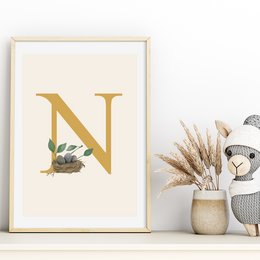 A decorative letter 'N' with a nature-inspired design, featuring a nest with eggs and leaves, suitable for a kids room poster or wall art.