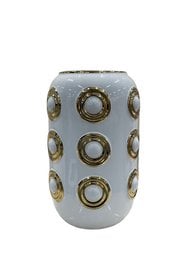 A tall, cylindrical white vase with gold circular patterns.