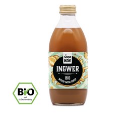 Organic ginger syrup in a glass bottle. The syrup has a golden-amber color and the label features illustrations of ginger roots and leaves.