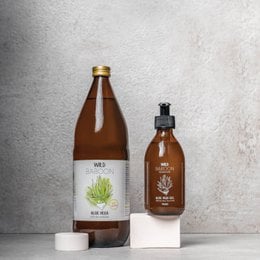 Organic aloe vera juice and gel in a clear glass bottle. The product is labeled as a "Starter kit" and is categorized as a "Supplement".