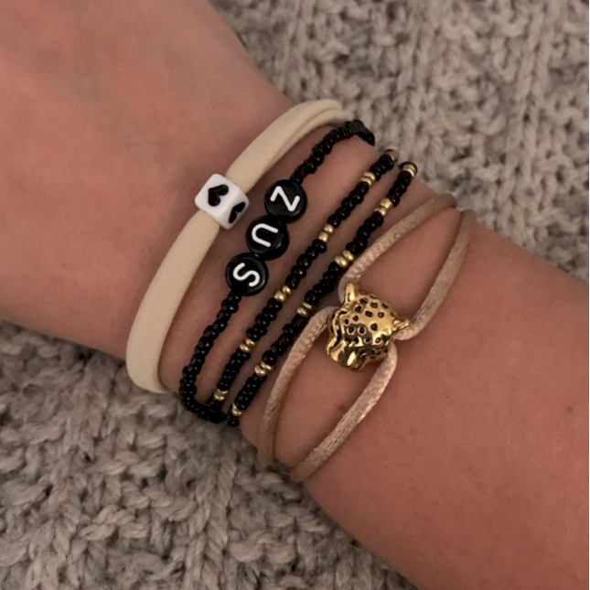 Beige black set of bracelets