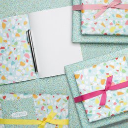 Colorful wrapping paper turquoise with terrazzo pattern, children pack gifts for children's birthday, for school or at birth