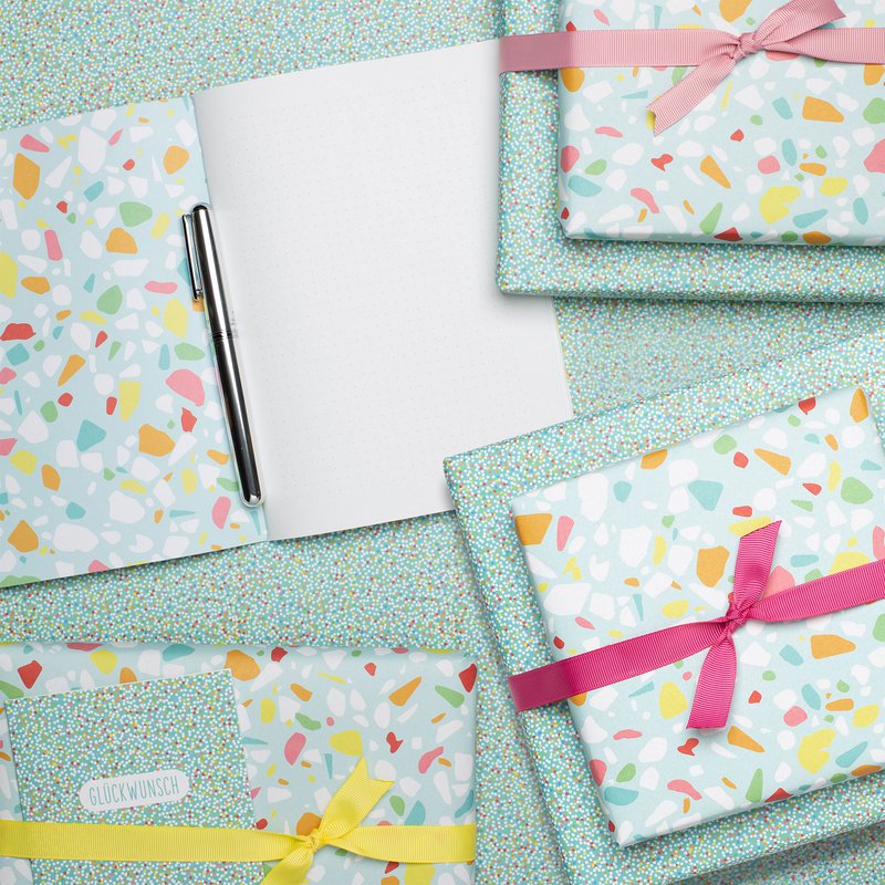 Colorful wrapping paper turquoise with terrazzo pattern, children pack gifts for children's birthday, for school or at birth