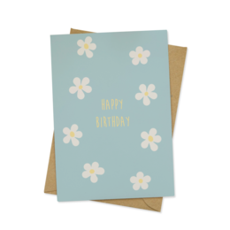 A greeting card with a light blue background and white flower designs. The text on the card reads "Happy Birthday".