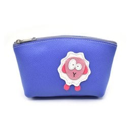 A handmade full grain leather makeup bag in a warm brown color, featuring a cute raccoon design applique.