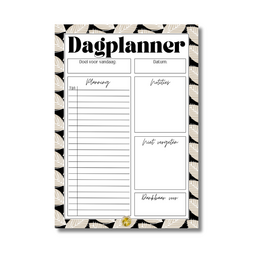 A black and white patterned day planner with sections for daily planning, notes, and to-do lists.