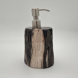 Petrified wood soap dispenser with a natural, rustic appearance and a stainless steel pump.