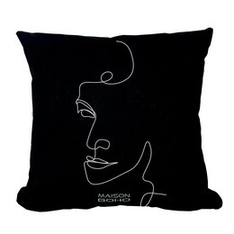 Black and white decorative cushion with abstract face design, suitable for living room or bedroom decor.