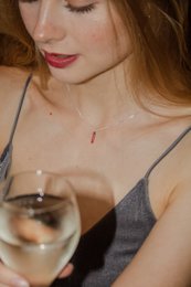 Gold and silver necklaces with "MAMA LOVE" engraved pendant. Delicate, minimalist jewelry for mothers.