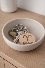  "Wooden zodiac sign keychain with Leo symbol, natural wood material, round shape, engraved astrology charm"