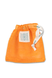 Beige fabric soap bag with black cord, suitable for storing and transporting soap.