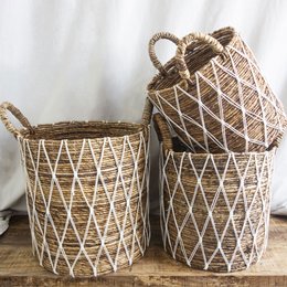 Set of 2 banana leaf and cotton storage baskets with diamond pattern design and rope handles.