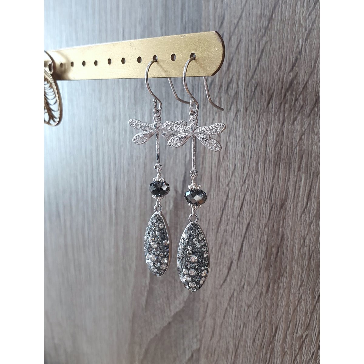 Rhodium plated dragonfly earrings with grey crystal drops