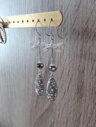 Rhodium plated dragonfly earrings with grey crystal drops