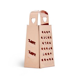  A rose gold-colored multifunctional grater with a heart-shaped design and various grating surfaces.