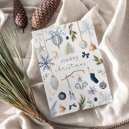 Blue botanical winter illustrations, snowflakes, festive plants, happy holidays text, cream textured paper card.