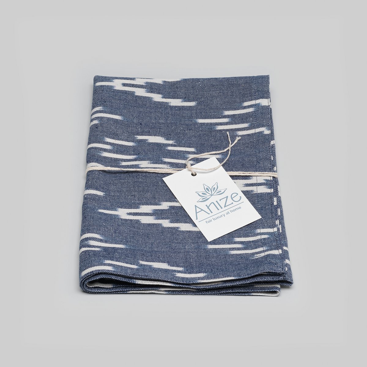 Tea towel, handwoven ikat, ecru v-pattern on navy blue