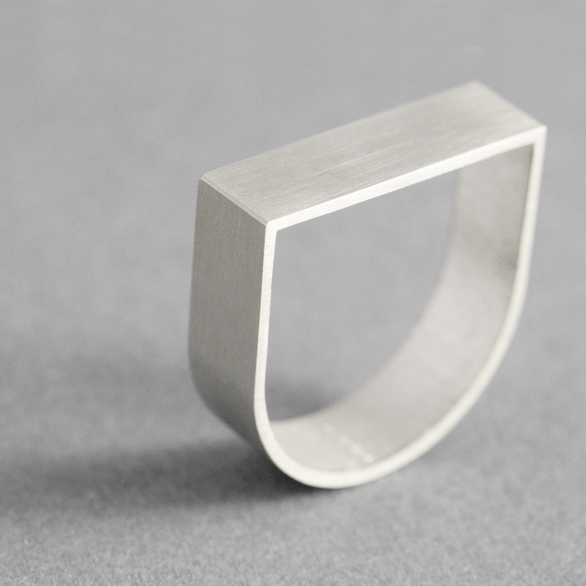 ARK Silver is a sculptural ring inspired by architecture and geometric form.