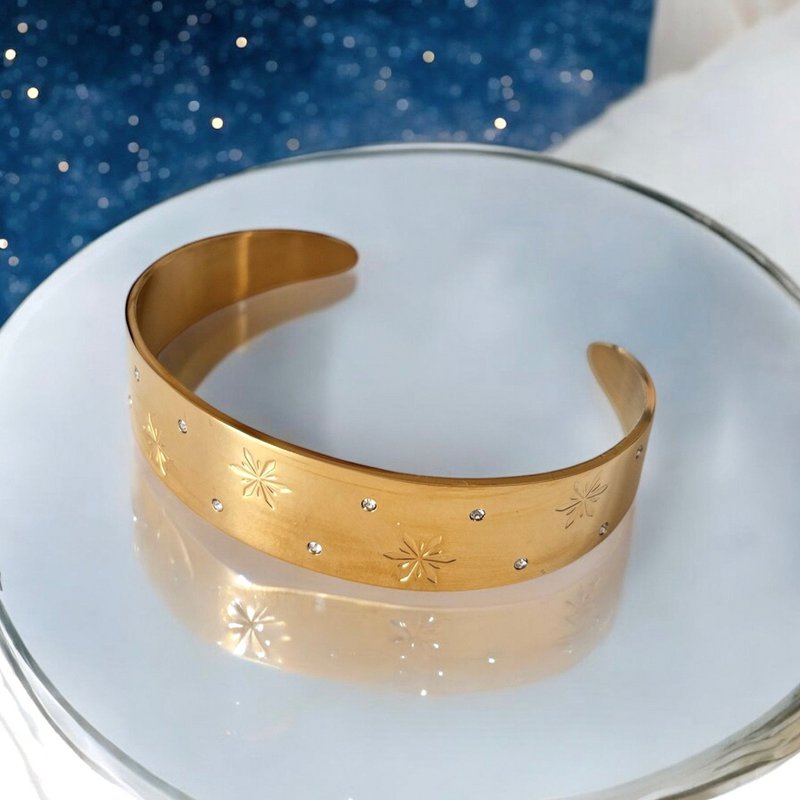 STELLAR GLOW - Rigid Bracelet with Stars in gold-plated steel