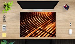 A large, rectangular desk pad made of wood with a diagonal pattern of slats in warm, fiery tones.