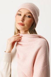 Soft, cozy pink cashmere beanie and scarf set. Warm, stylish accessory for cold weather.
