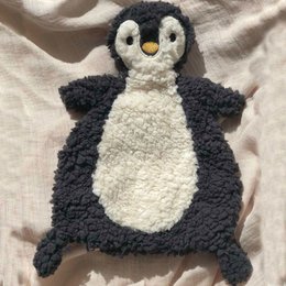 Soft, plush penguin cuddle cloth in black and white colors with a cute, round shape.