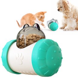 Colorful dog treat leaking toy in blue, pink, green, yellow, and black colors. The toy is designed to dispense treats as the dog plays with it, encouraging mental stimulation and physical activity.