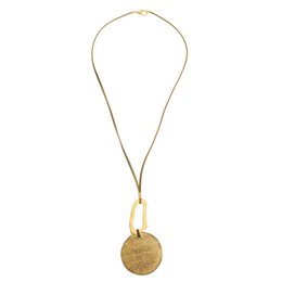 Gold-toned necklace with halo and disc pendant, suitable for casual or formal wear.