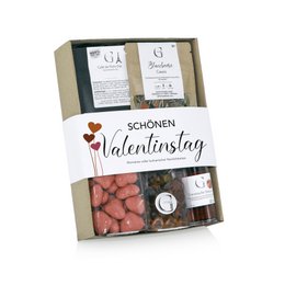 This Valentine's Day gift set includes a variety of candy, chocolate, and other treats presented in a decorative box. The set features a mix of sweet and savory items, including a bottle of wine, candied nuts, and chocolate-covered strawberries.