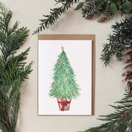 "Watercolor Christmas tree greetings card with a festive green tree and red pot. The card is perfect for sending holiday wishes."