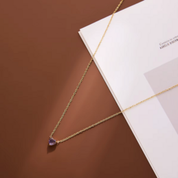 Gold chain necklace with small heart pendant, ruby red birthstone, delicate jewelry, July birthstone.