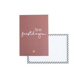 A6 Christmas card with the text "fine festive" printed in white on a pink background. The card is accompanied by a brown envelope.
