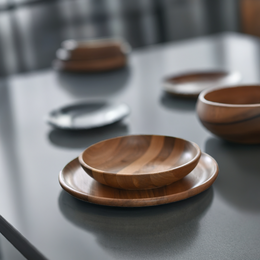  Wooden bowl with a natural, rustic design. Made of walnut wood with a smooth, rounded shape. Suitable for serving food or as a decorative piece.