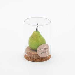 A glass dome with a green pear inside, resting on a wooden base with a label that says "Toffee pear".