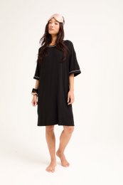  A classic black tee dress made of soft, breathable bamboo fabric. Features a relaxed, comfortable fit and a simple, elegant design.