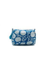 Blue quilted toiletry bag with white floral circular pattern, tassel detail, small cosmetic pouch.