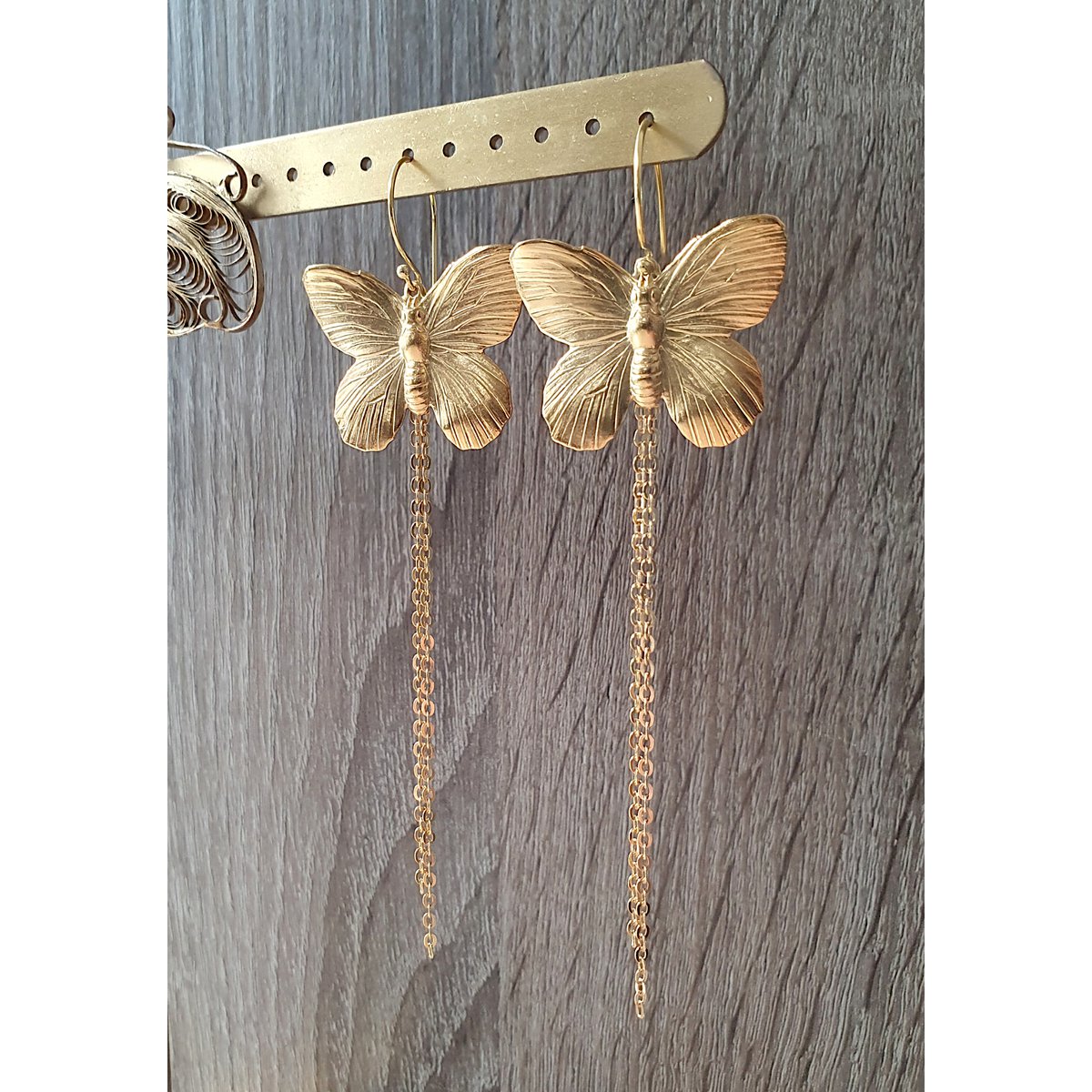 Long-length rhodium plated butterfly earrings