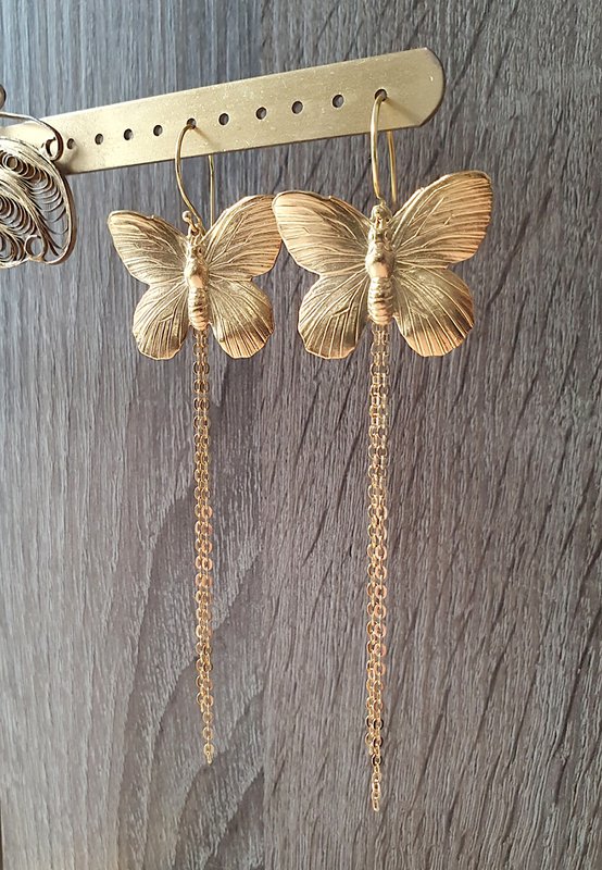 Long-length rhodium plated butterfly earrings