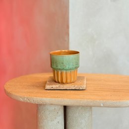  Stoneware cupcake cup in a spring glow color with a textured, ribbed design.