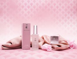 Elastin serum in pink packaging with floral accents, designed for facial skin care.