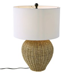 Woven rattan base, natural tan wicker, white linen cylindrical shade, coastal style table lamp.