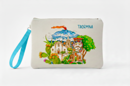 Clutch bag featuring a colorful illustration of the Taormina landscape, including a historic building, palm trees, and a volcano in the background.
