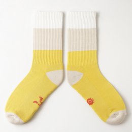 Yellow and white striped socks with a ladybug design.