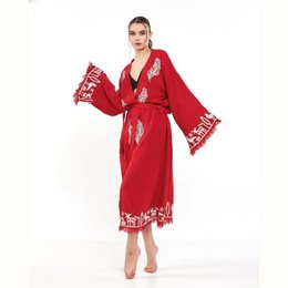  Long red kimono with white floral print, featuring wide sleeves and a wrap-around design. Ideal for loungewear or as a beach cover-up.