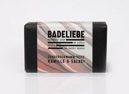 Handmade soap bar with chamomile and sage, rectangular shape, brown color.