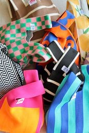 Black and white wave pattern handbag, colorful geometric design, spacious tote style bag with vibrant accents.