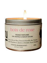 Rosewood scented candle with a warm, floral aroma in a round glass container.